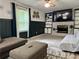 Inviting living room with a fireplace, built-in shelves and comfortable seating at 460 Heathrow Way, Stone Mountain, GA 30087