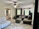 Comfortable living room with a large sectional sofa and plenty of natural light at 460 Heathrow Way, Stone Mountain, GA 30087