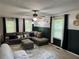 Cozy living room features a comfortable sofa and stylish décor at 460 Heathrow Way, Stone Mountain, GA 30087