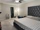 Main bedroom with modern decor, a large headboard, and ample space at 460 Heathrow Way, Stone Mountain, GA 30087