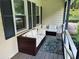 Inviting porch with wicker seating, plush cushions, and stylish outdoor rug creates a cozy space at 460 Heathrow Way, Stone Mountain, GA 30087
