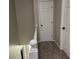 Carpeted staircase with white railing, leading to the upper level of this inviting home at 460 Heathrow Way, Stone Mountain, GA 30087