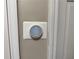 Image shows a digital thermostat on the wall inside the house at 460 Heathrow Way, Stone Mountain, GA 30087