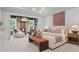 Luxurious main bedroom features a sitting area, natural light, and elegant décor, creating a tranquil retreat at 4790 Wayt Farm Overlook, Cumming, GA 30040