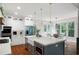 Modern kitchen featuring stainless steel appliances, a large island, and stylish pendant lighting at 113 Stargaze Rdg, Canton, GA 30114