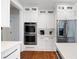 Well-lit kitchen offering stainless steel appliances and custom cabinets for storage at 113 Stargaze Rdg, Canton, GA 30114