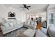 Open-concept living room that flows into a kitchen with great natural light and hardwood floors at 113 Stargaze Rdg, Canton, GA 30114