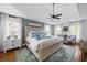 Inviting main bedroom with tray ceiling, plush bedding, and window views at 113 Stargaze Rdg, Canton, GA 30114
