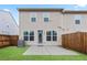 Backyard view featuring patio, lawn, and wood fence at 2231 Bedell Dr, Conyers, GA 30094