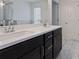 Bathroom featuring a double sink vanity with dark cabinets and white countertop at 2231 Bedell Dr, Conyers, GA 30094