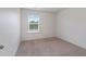 Bright, empty bedroom with neutral carpet and natural light at 2231 Bedell Dr, Conyers, GA 30094