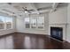 Bright living room boasts coffered ceilings, a fireplace, and plenty of natural light from the windows at 2231 Bedell Dr, Conyers, GA 30094