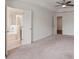Spacious main bedroom showing two doors leading to the bathroom and closet at 2231 Bedell Dr, Conyers, GA 30094