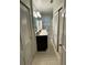Bright bathroom features a white tiled floor and a dark vanity at 276 Colewood Nw Way, Atlanta, GA 30328
