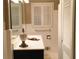 Traditional bathroom featuring a classic vanity and tiled walls at 276 Colewood Nw Way, Atlanta, GA 30328