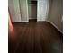 Cozy bedroom featuring a built-in closet and hardwood floors, offering ample storage space at 276 Colewood Nw Way, Atlanta, GA 30328