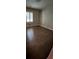 Inviting bedroom showcasing hardwood floors and a large window offering ample natural light at 276 Colewood Nw Way, Atlanta, GA 30328