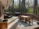Inviting back deck with a grill, dining set, and outdoor seating, perfect for enjoying outdoor meals at 276 Colewood Nw Way, Atlanta, GA 30328