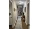 Inviting hallway with built-in bookshelves and elegant décor at 276 Colewood Nw Way, Atlanta, GA 30328