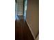 Hallway with hardwood floors and built in shelving at 276 Colewood Nw Way, Atlanta, GA 30328