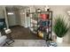 Bright living room with hardwood floors, area rug, and bookshelf at 276 Colewood Nw Way, Atlanta, GA 30328