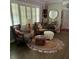 Living room with chairs, round carpet and window at 276 Colewood Nw Way, Atlanta, GA 30328