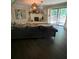 Spacious living room with a fireplace, large window, and comfortable couch, great for relaxing at 276 Colewood Nw Way, Atlanta, GA 30328