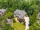 A high definition aerial shot of the property showing its manicured lawns, landscaping and circular driveway at 4789 Crest Park Ln, Marietta, GA 30068