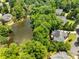 Beautiful aerial view showcasing the serene pond and lush surrounding of the residences at 4789 Crest Park Ln, Marietta, GA 30068