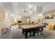 Spacious basement area with a billiards table, fireplace and casual seating at 4789 Crest Park Ln, Marietta, GA 30068
