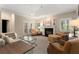 Relaxing room with a fireplace and a lot of natural light coming from windows with shutters at 4789 Crest Park Ln, Marietta, GA 30068