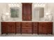 Bathroom with a double vanity with granite countertops, and sinks, and wooden cabinets at 4789 Crest Park Ln, Marietta, GA 30068
