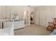 Spacious Bedroom area with changing table, rocker, and closet space at 4789 Crest Park Ln, Marietta, GA 30068