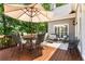 Spacious deck with an umbrella, plenty of seating and lush green trees around at 4789 Crest Park Ln, Marietta, GA 30068