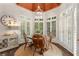 Charming breakfast nook with wooden table, multiple windows, and a beautiful wood ceiling at 4789 Crest Park Ln, Marietta, GA 30068