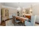 Elegant dining room features hardwood floors, a classic chandelier, and refined décor at 4789 Crest Park Ln, Marietta, GA 30068