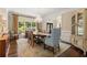 Bright dining room with hardwood floors, chandelier, and large windows provides great views at 4789 Crest Park Ln, Marietta, GA 30068