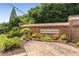 The brick entrance to Lake Crest Estates provides a warm welcome with its elegant landscaping and signage at 4789 Crest Park Ln, Marietta, GA 30068