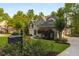 Charming home with manicured landscaping, flowering bushes, and distinctive mailbox at 4789 Crest Park Ln, Marietta, GA 30068