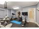 Well-equipped home gym with various exercise machines and access to a shower at 4789 Crest Park Ln, Marietta, GA 30068