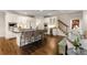 Spacious kitchen boasts an island with seating and stairs leading to the upper level at 4789 Crest Park Ln, Marietta, GA 30068