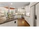 Bright kitchen with stainless steel appliances, granite counters, and hardwood floors at 4789 Crest Park Ln, Marietta, GA 30068