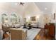 Bright living room with hardwood floors, a vaulted ceiling, and large windows with plantation shutters at 4789 Crest Park Ln, Marietta, GA 30068