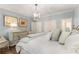 Relaxing main bedroom with soft blue walls, neutral furniture, and ample natural light at 4789 Crest Park Ln, Marietta, GA 30068