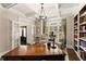 Bright office with coffered ceilings, built-in bookcases, and natural light exudes sophistication at 4789 Crest Park Ln, Marietta, GA 30068