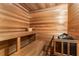 Wooden sauna featuring wooden benches and a rock-filled heater at 4789 Crest Park Ln, Marietta, GA 30068