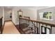 Elegant foyer staircase featuring wood and iron railings, a chandelier, and a view to the front door at 4789 Crest Park Ln, Marietta, GA 30068