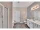 Bathroom featuring a shower with glass door, tub, toilet, and vanity with sink and lighting at 903 Duncan Ter, Canton, GA 30115