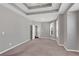 Large bedroom with tray ceilings, ceiling fan, and multiple windows creating a bright and airy atmosphere at 903 Duncan Ter, Canton, GA 30115