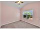Cozy bedroom with neutral carpet and large window offering natural light at 903 Duncan Ter, Canton, GA 30115